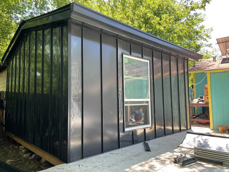 Black standing seam metal wall panels for Metal Roof Installation in Winters