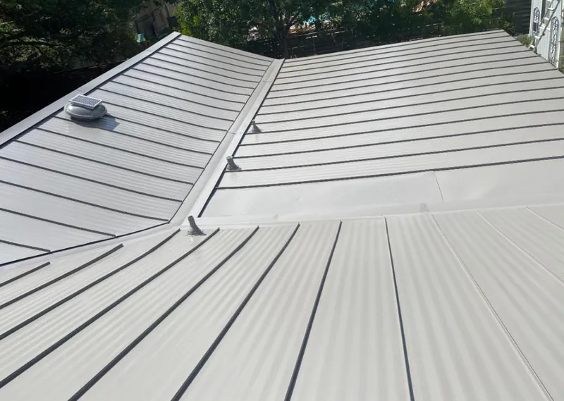 Solar attic fan installed on a metal roof for Roof Ventilation in Winters